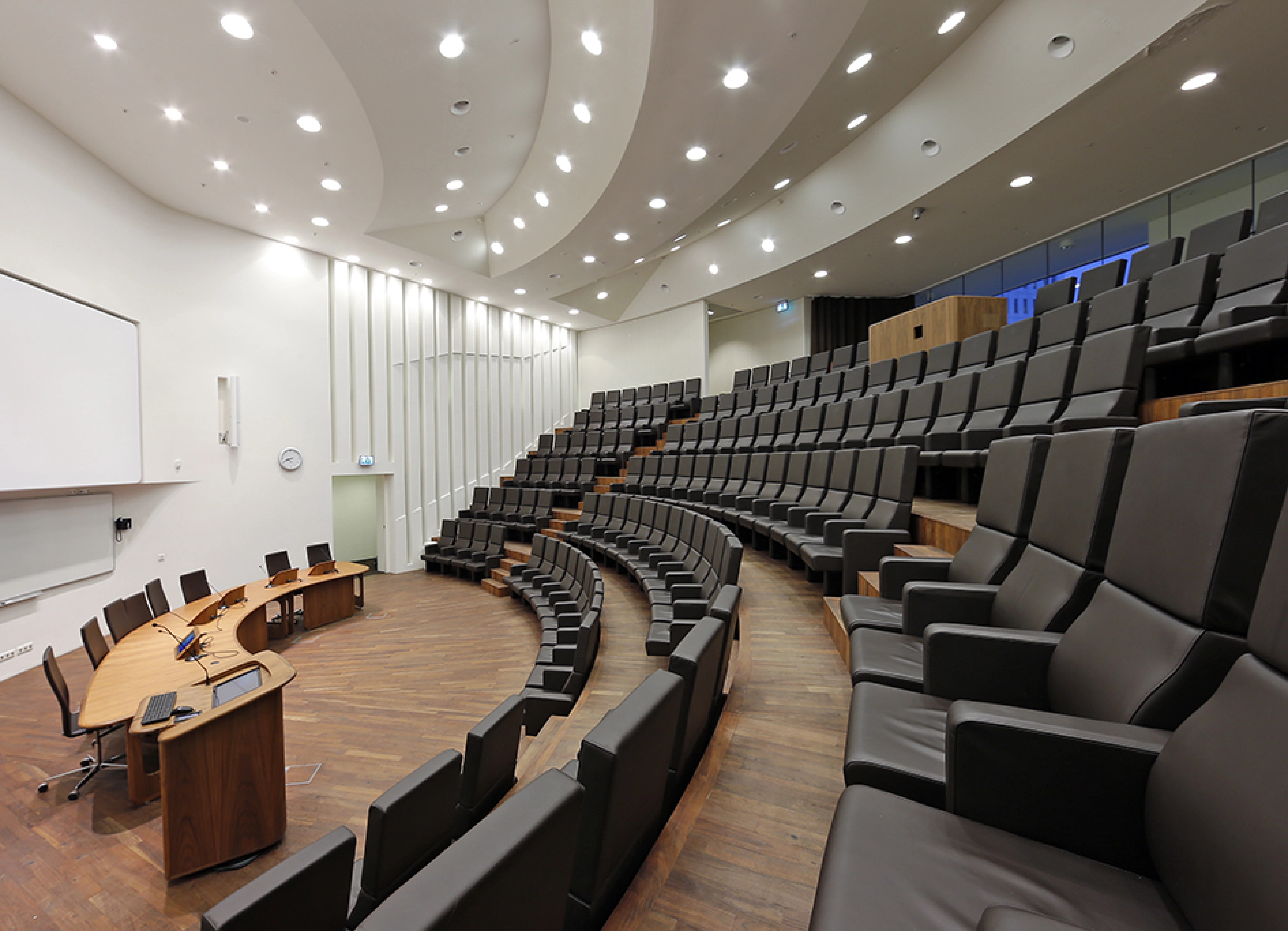 View of the Andries Querido lecture room at Erasmus MC, with brown chairs. Seen from the left.